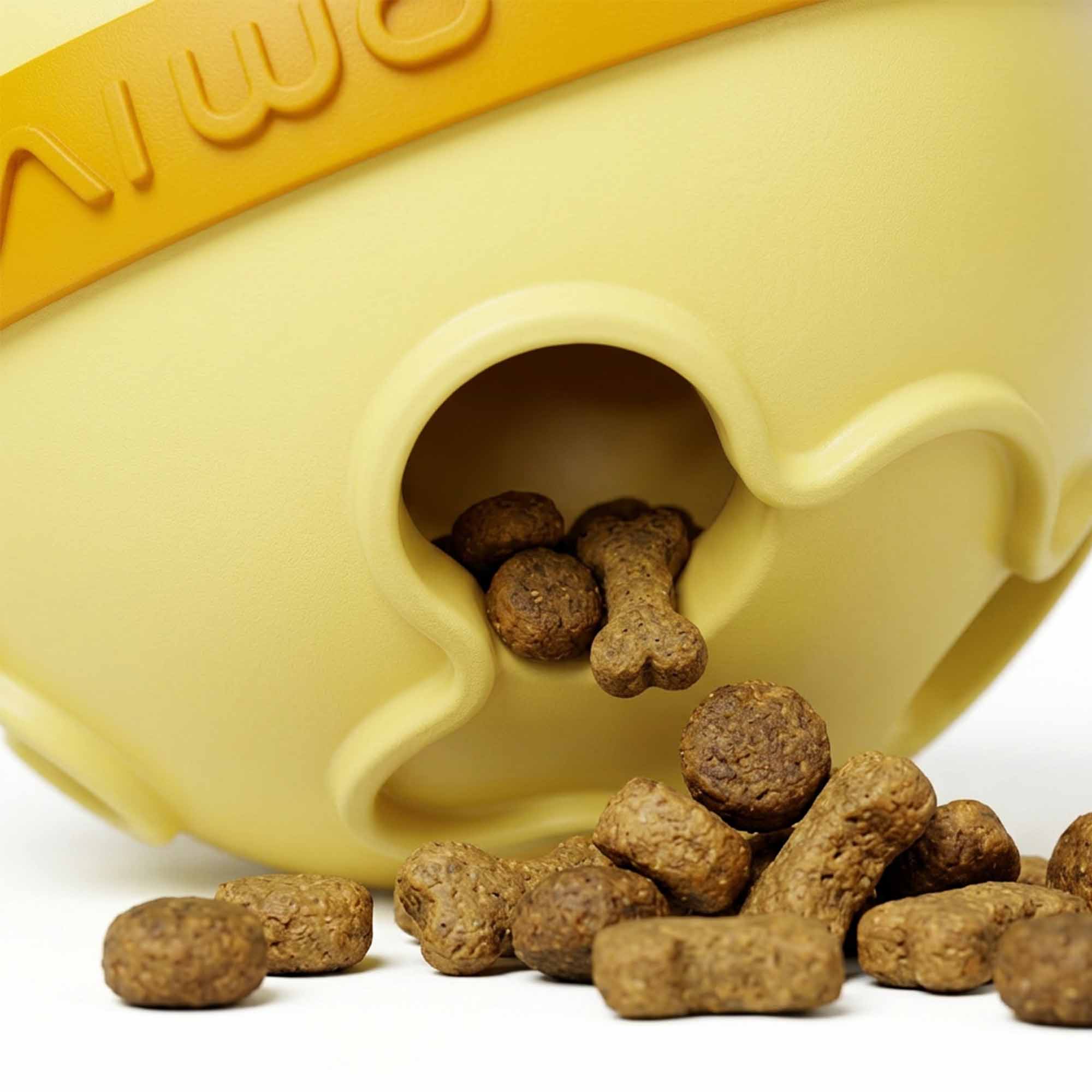 Close-up of treat dispenser dog toy holes – perfect size for slow kibble release, mental challenge, and gum massage on food-grade TPR