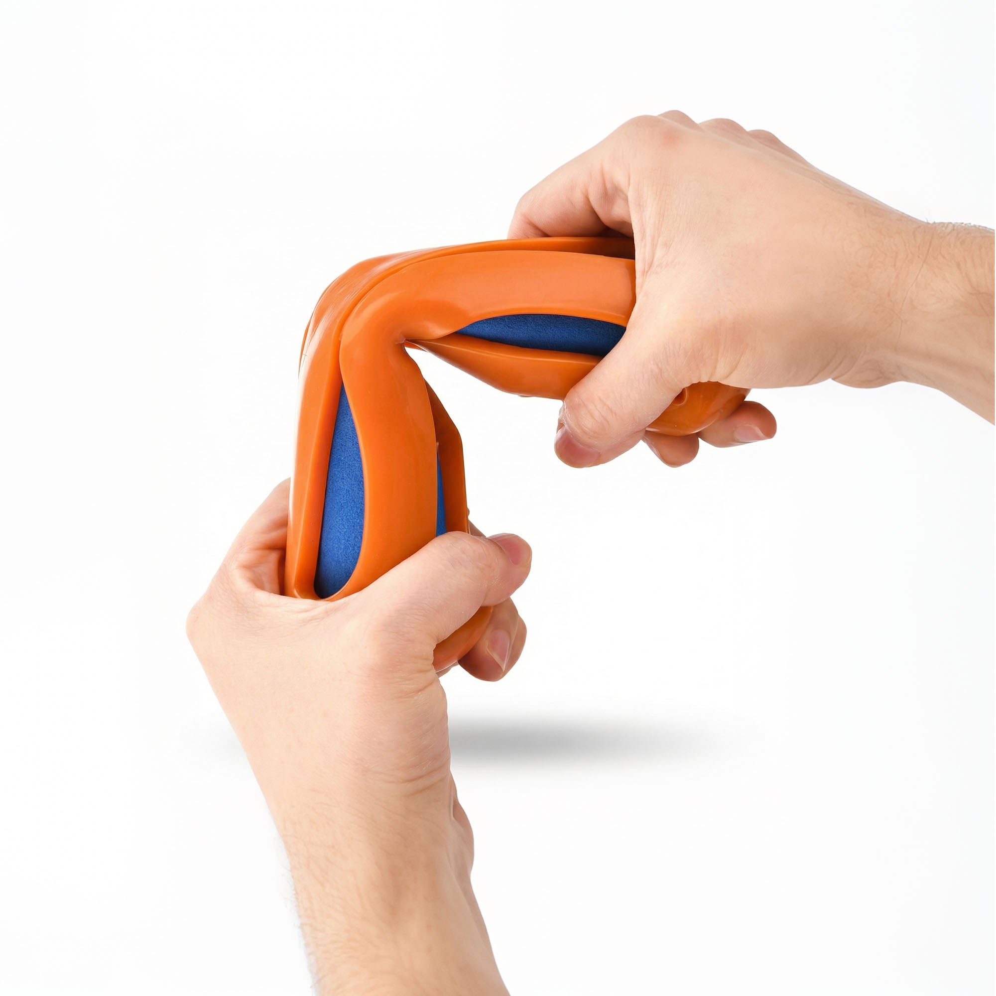 Person twisting Durable Swim Noodle Dog Toy to demonstrate its strength and indestructibility for aggressive chewers